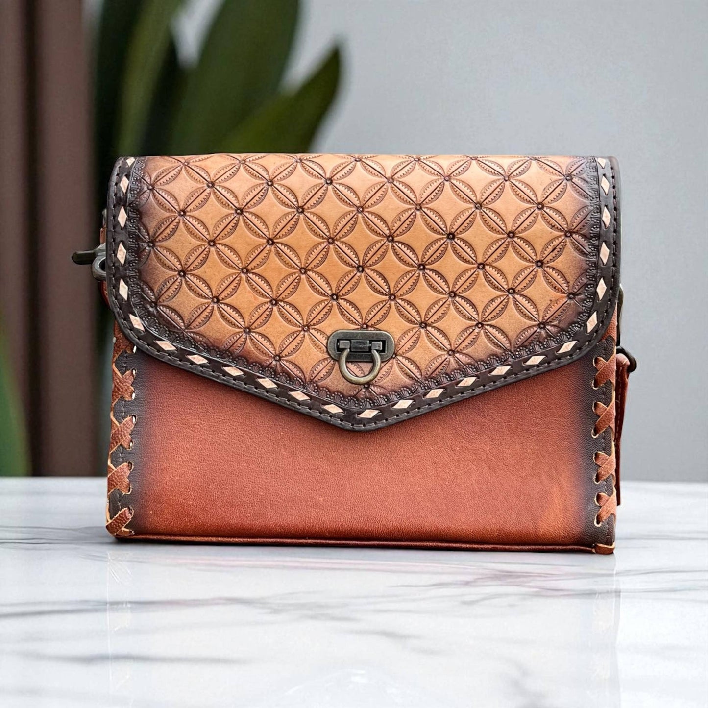 Lily tooled leather crossbody bag